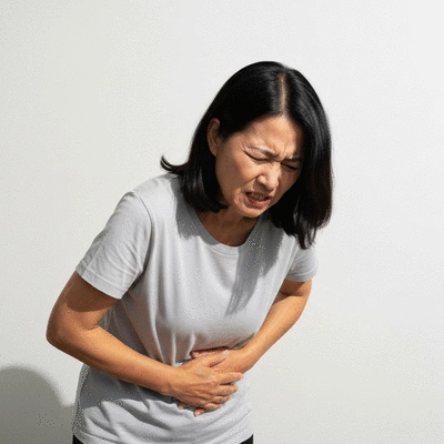 Person experiencing abdominal discomfort, representing constipation